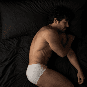 A man sleeping in his underwear